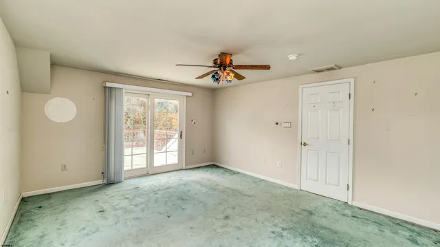 a view of an empty room and window