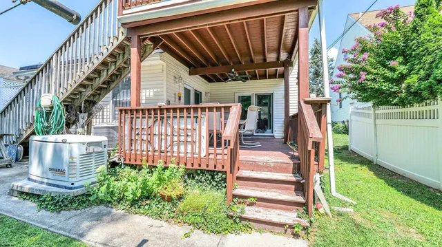 a view of a patio with a table and chairs