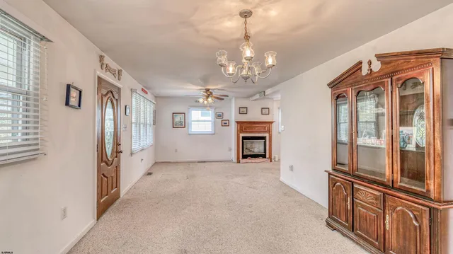a view of a hallway with chandelier