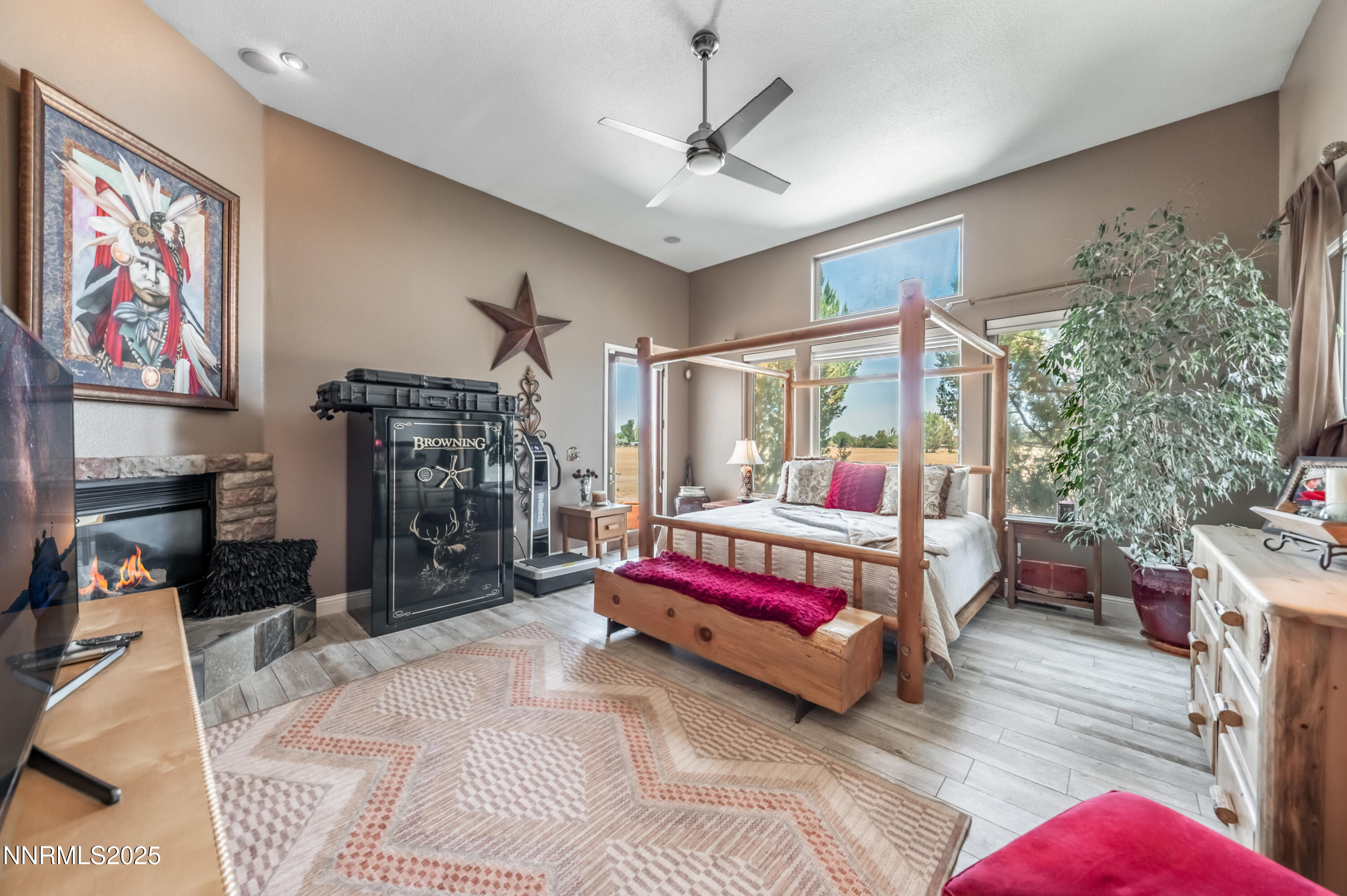 4433 Casey Road Fallon, NV 89406 - Photo 29 of 71 a bedroom with a bed a chandelier and a couch