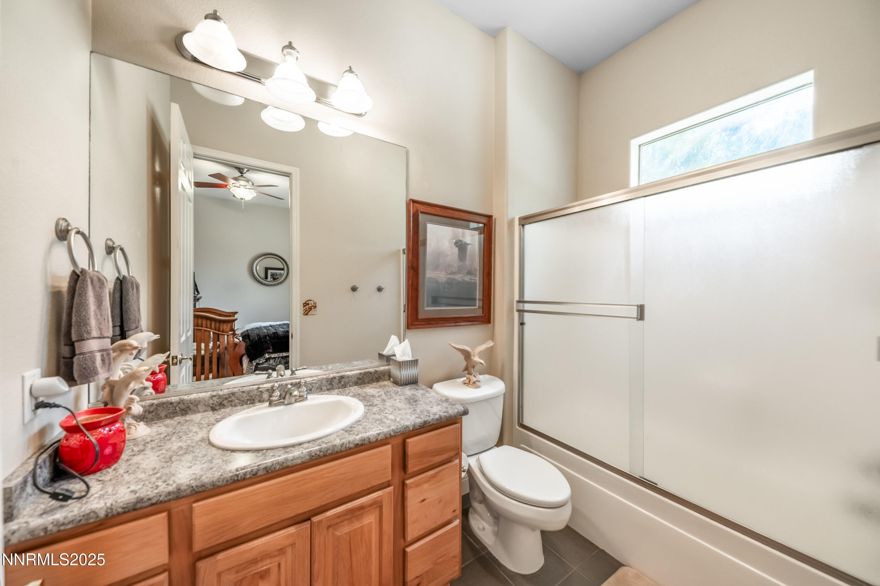 4433 Casey Road Fallon, NV 89406 - Photo 45 of 71 a bathroom with a granite countertop sink mirror vanity and toilet