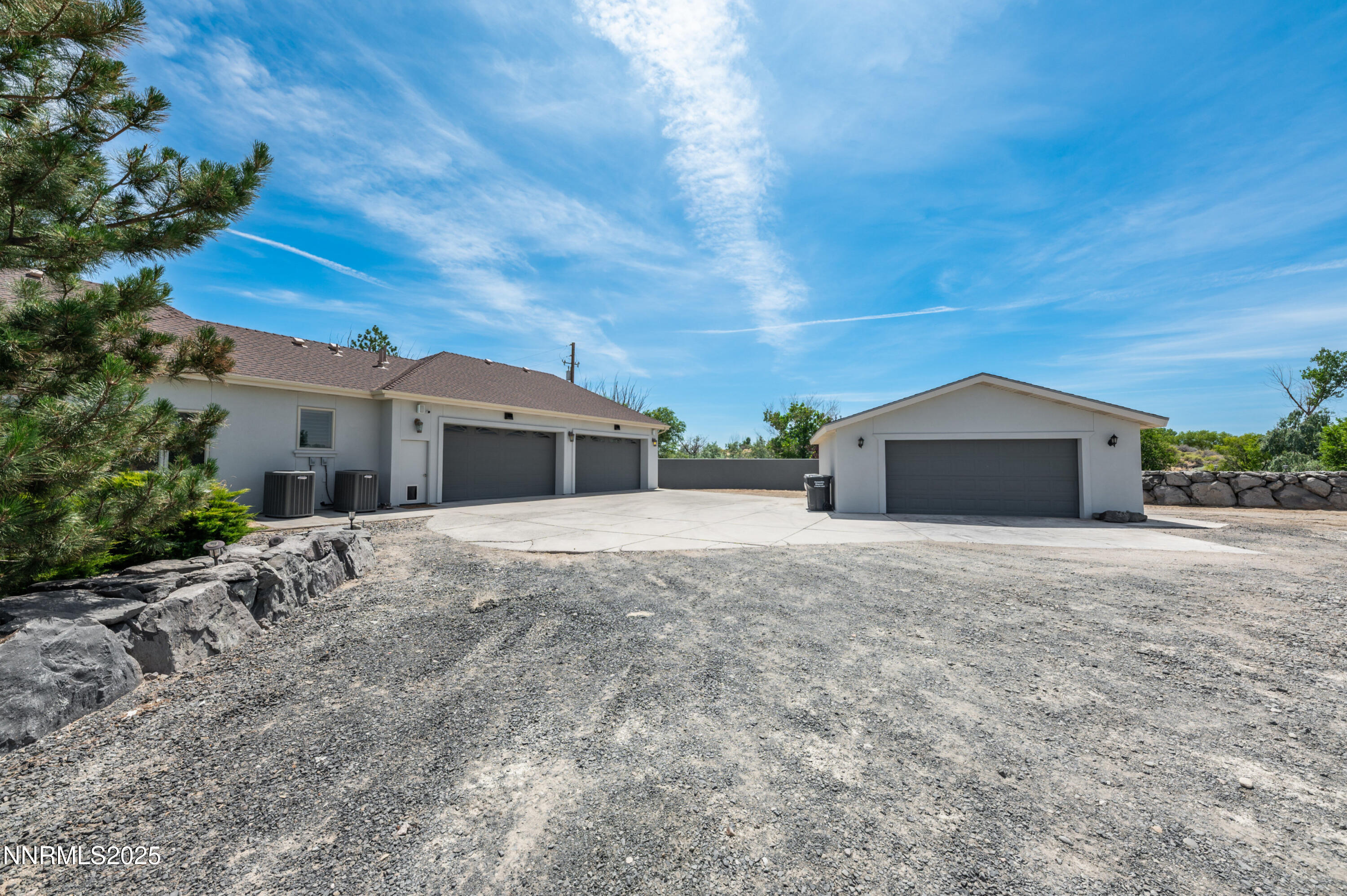 4433 Casey Road Fallon, NV 89406 - Photo 69 of 71 a front view of a house with a yard and garage