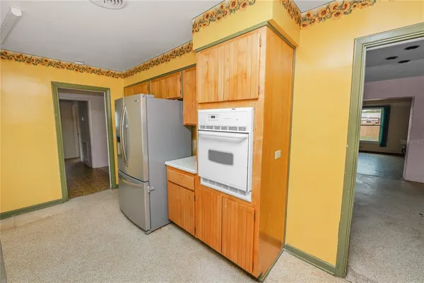 a kitchen with stainless steel appliances a refrigerator and a sink