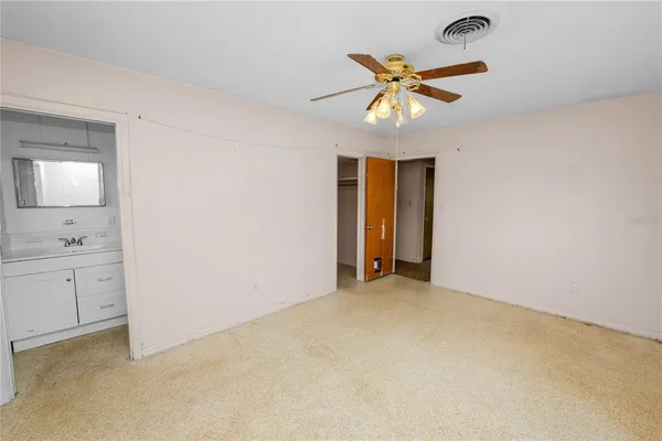 a bathroom with a toilet sink and shower