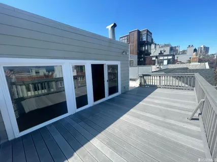 an aerial view of a house with a lake view