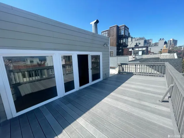 an aerial view of a house with a lake view