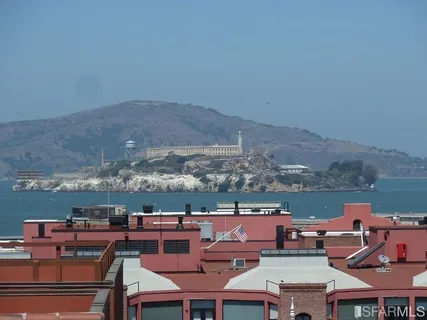 a view of balcony with two chairs and wooden floor