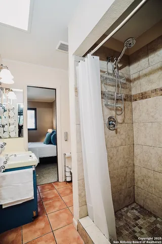 a bathroom with a sink and a shower