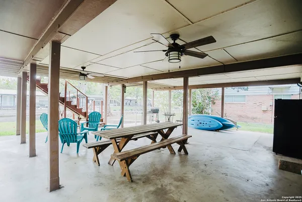 a room with lots of furniture and windows