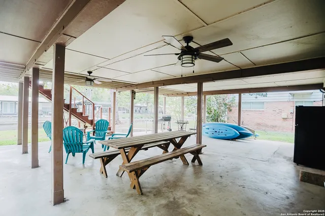 a room with lots of furniture and windows