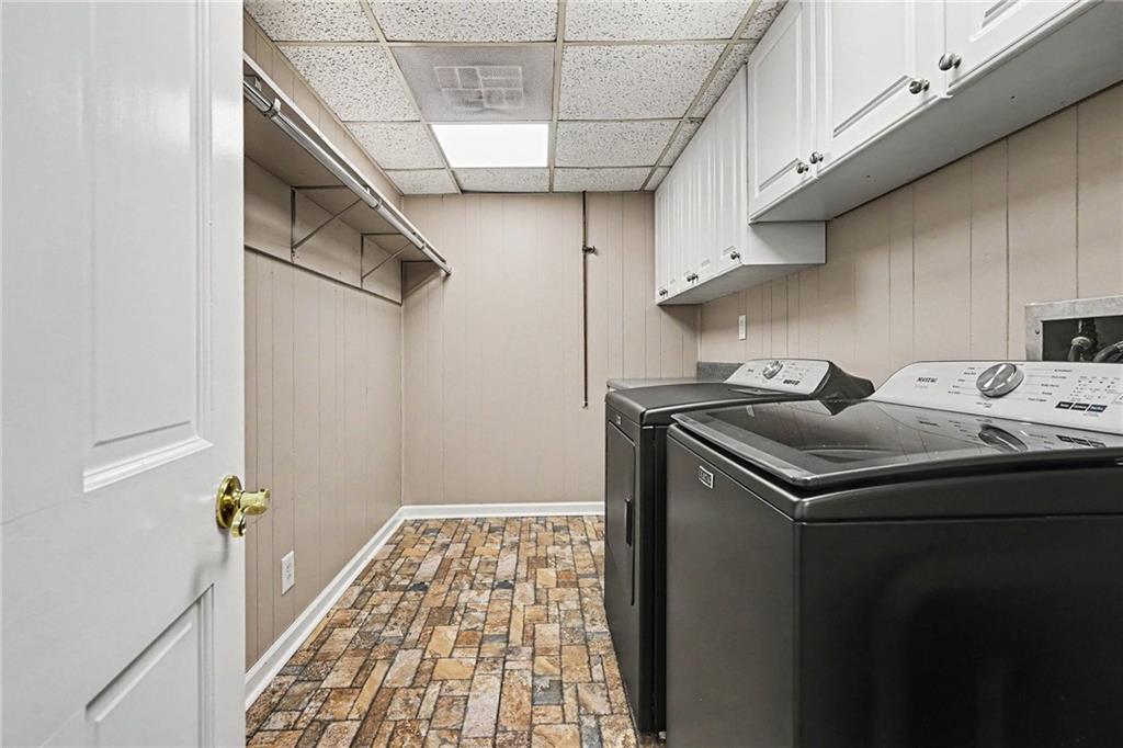 740 Smyrna Road Southwest Conyers, GA 30094 - Photo 22 of 27 a utility room with dryer and washer
