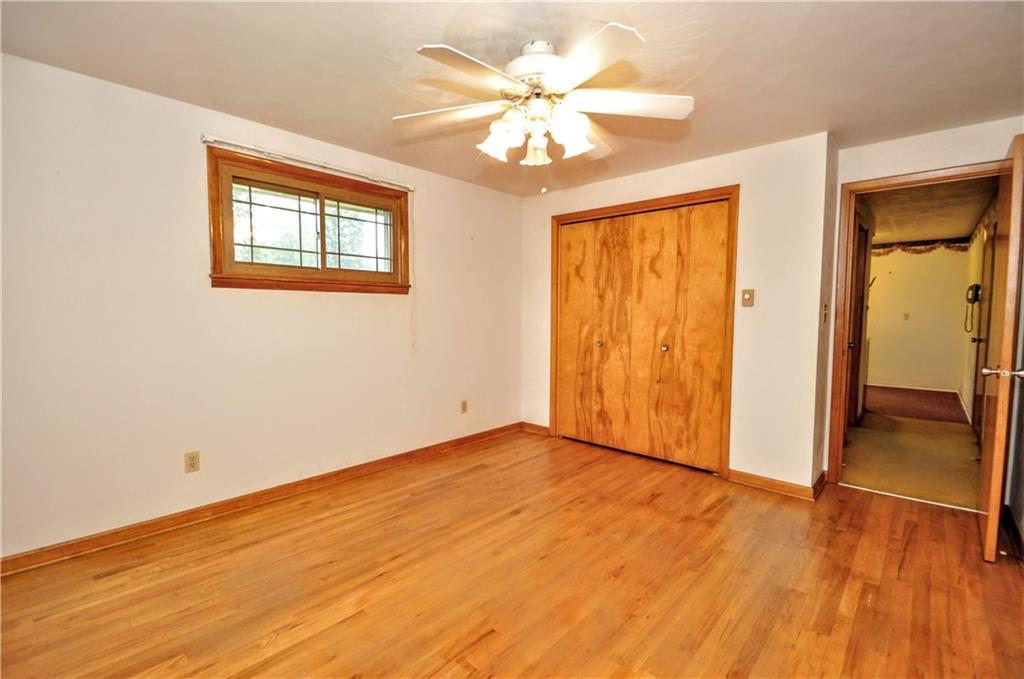 185 Highway 31 Ruffs Dale, PA 15679 - Photo 11 of 25 a view of an empty room with wooden floor