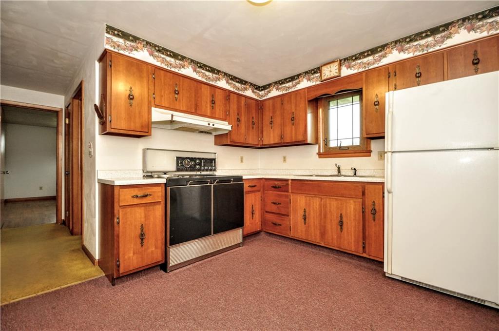 185 Highway 31 Ruffs Dale, PA 15679 - Photo 7 of 25 a kitchen with stainless steel appliances granite countertop a refrigerator a stove a sink and a microwave