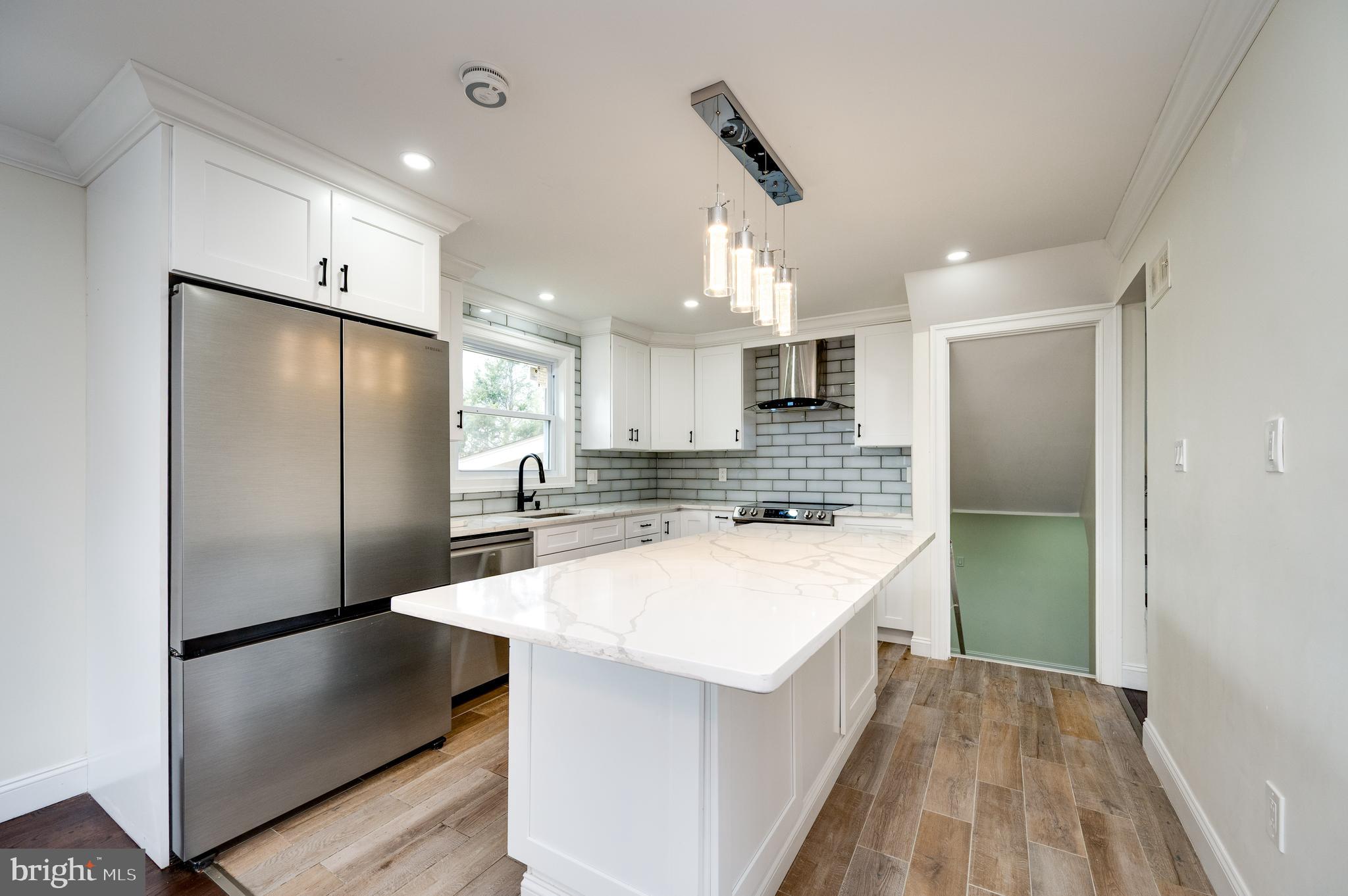 12 Vista Road Reading, PA 19610 - Photo 13 of 39 a kitchen with kitchen island a sink appliances and cabinets