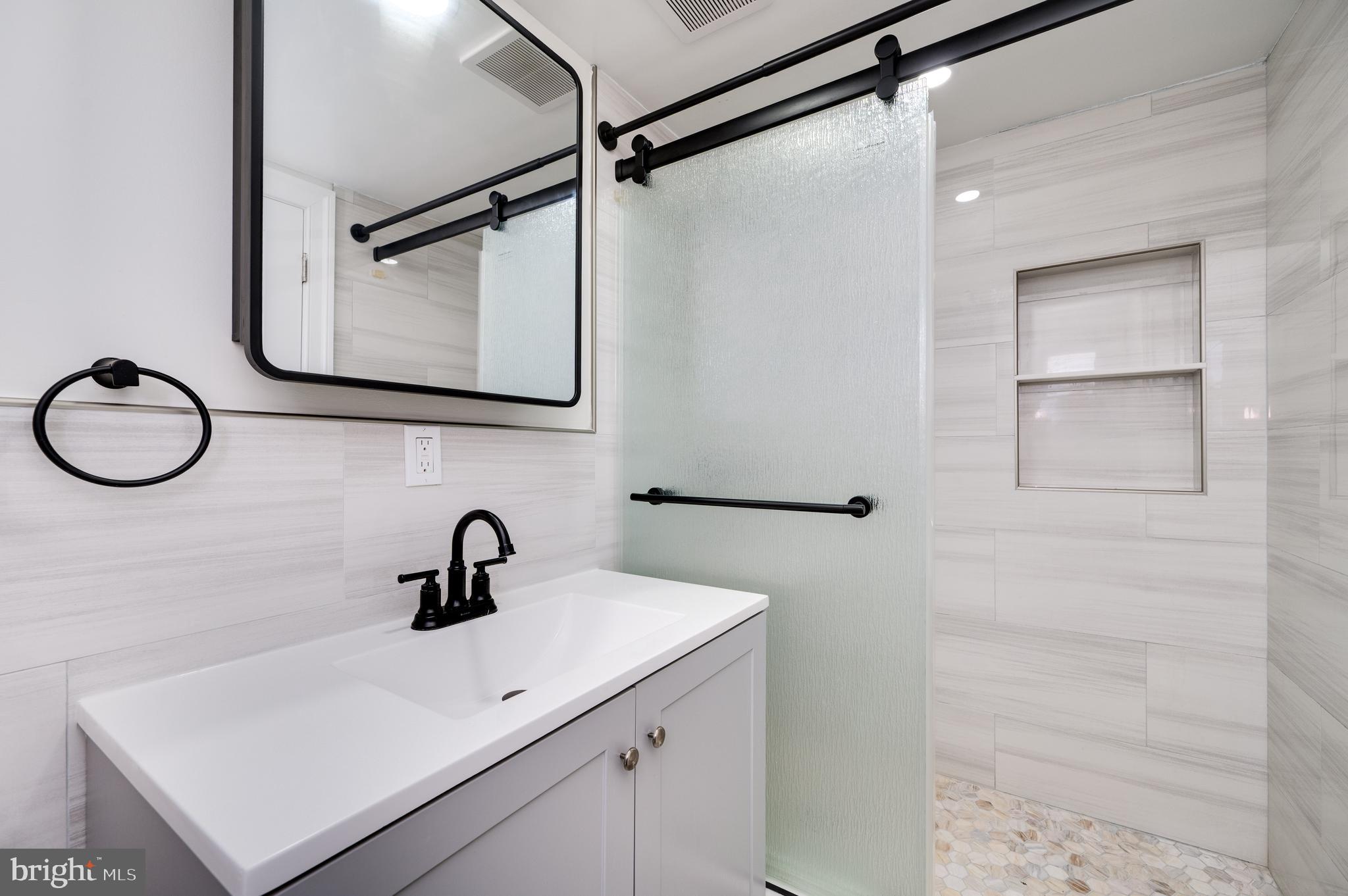 12 Vista Road Reading, PA 19610 - Photo 31 of 39 a bathroom with a sink and mirror