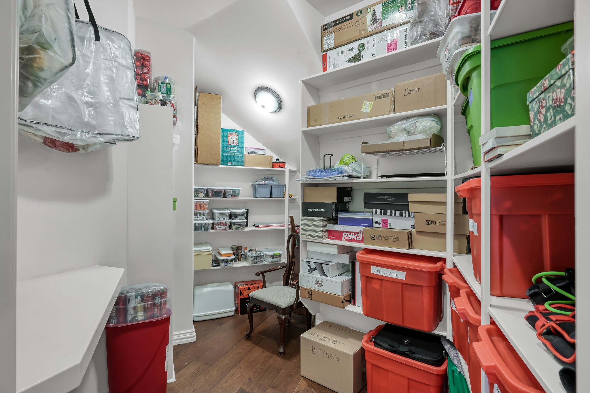 16318 Perry Pass Court Spring, TX 77379 - Photo 17 of 49 Convenient to the living area and secondary bedrooms is this large closet with built-ins. The perfect space for a craft room and storing holiday decor.