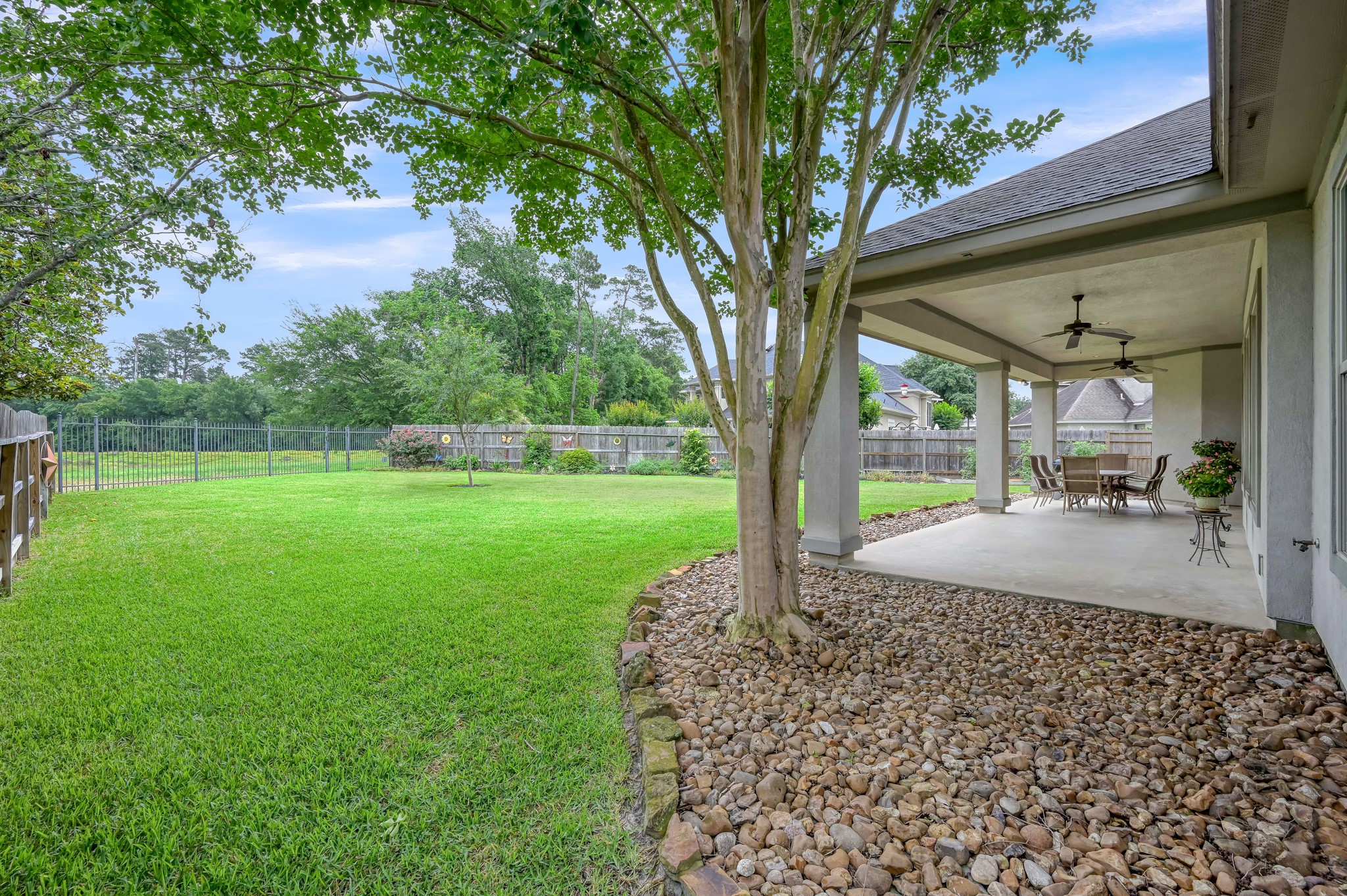 16318 Perry Pass Court Spring, TX 77379 - Photo 33 of 49 The patio is wired for sound and has ceiling fans.