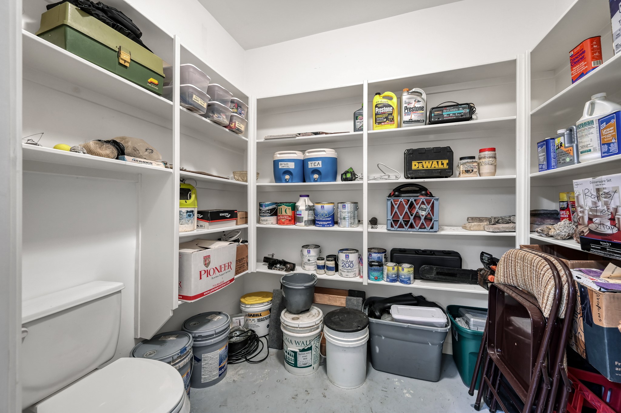 16318 Perry Pass Court Spring, TX 77379 - Photo 39 of 49 This additional storage room has a toilet and shelves!