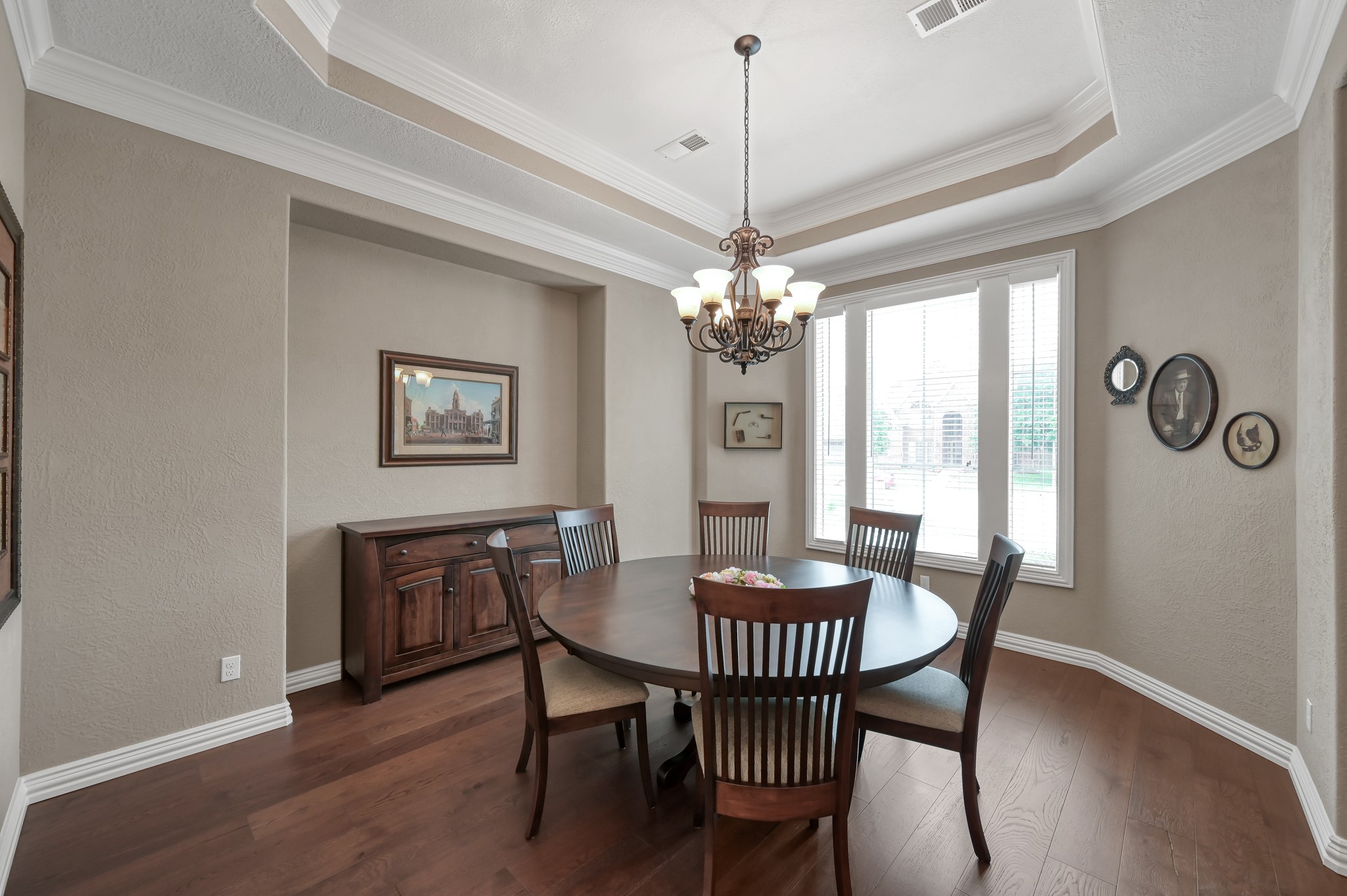 16318 Perry Pass Court Spring, TX 77379 - Photo 4 of 49 The formal dining room has a tray ceiling and a wall insert with room for large buffet making room for a large table and chairs.