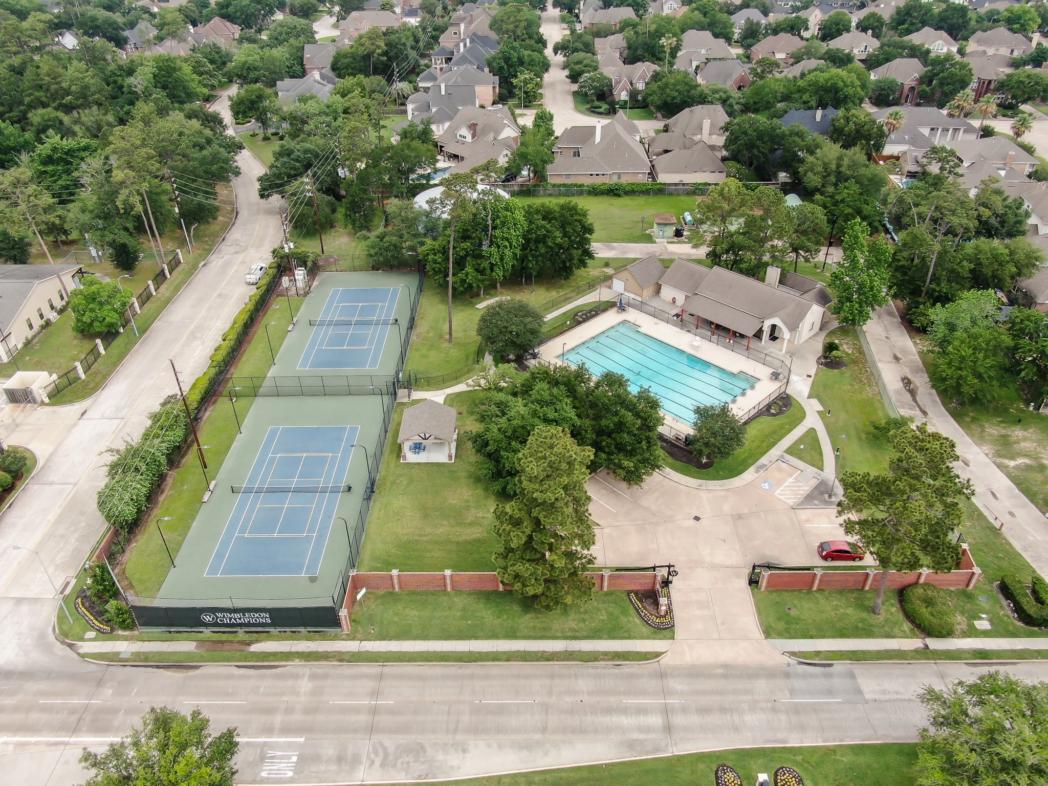 16318 Perry Pass Court Spring, TX 77379 - Photo 45 of 49 There is a swimming pool, tennis courts with a covered picnic area and a clubhouse for residents to use.