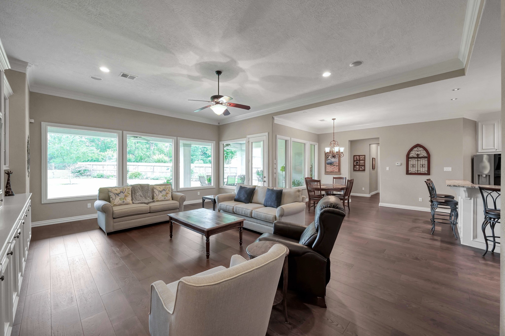 16318 Perry Pass Court Spring, TX 77379 - Photo 7 of 49 The family room has an eleven foot ceiling with recessed lighting and speakers. This space is open to the kitchen and breakfast room; all with views of the outdoors.