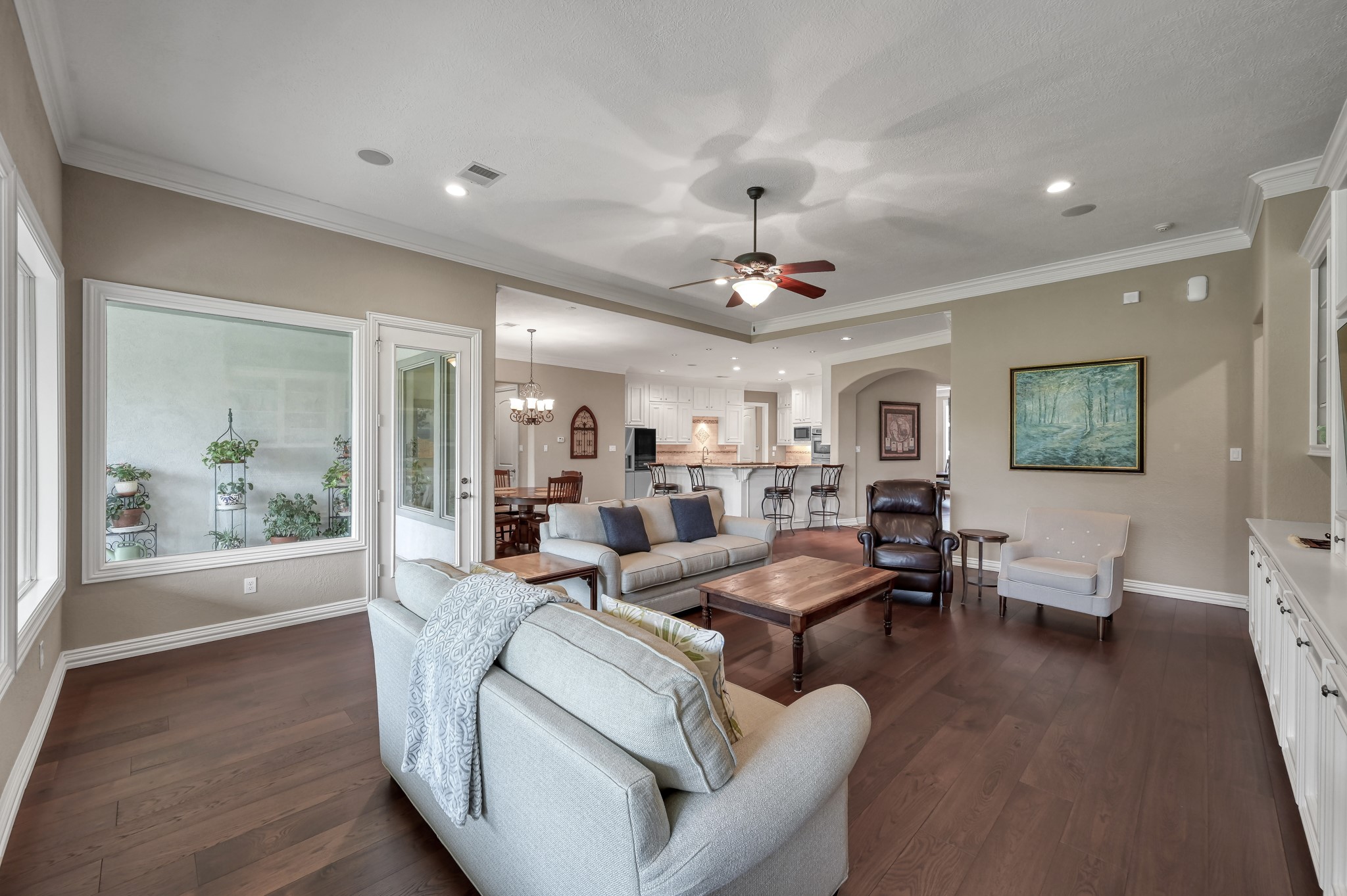 16318 Perry Pass Court Spring, TX 77379 - Photo 8 of 49 Another view of the family room and proximity to the entry and kitchen. A large arched doorway make this space perfect for entertaining.