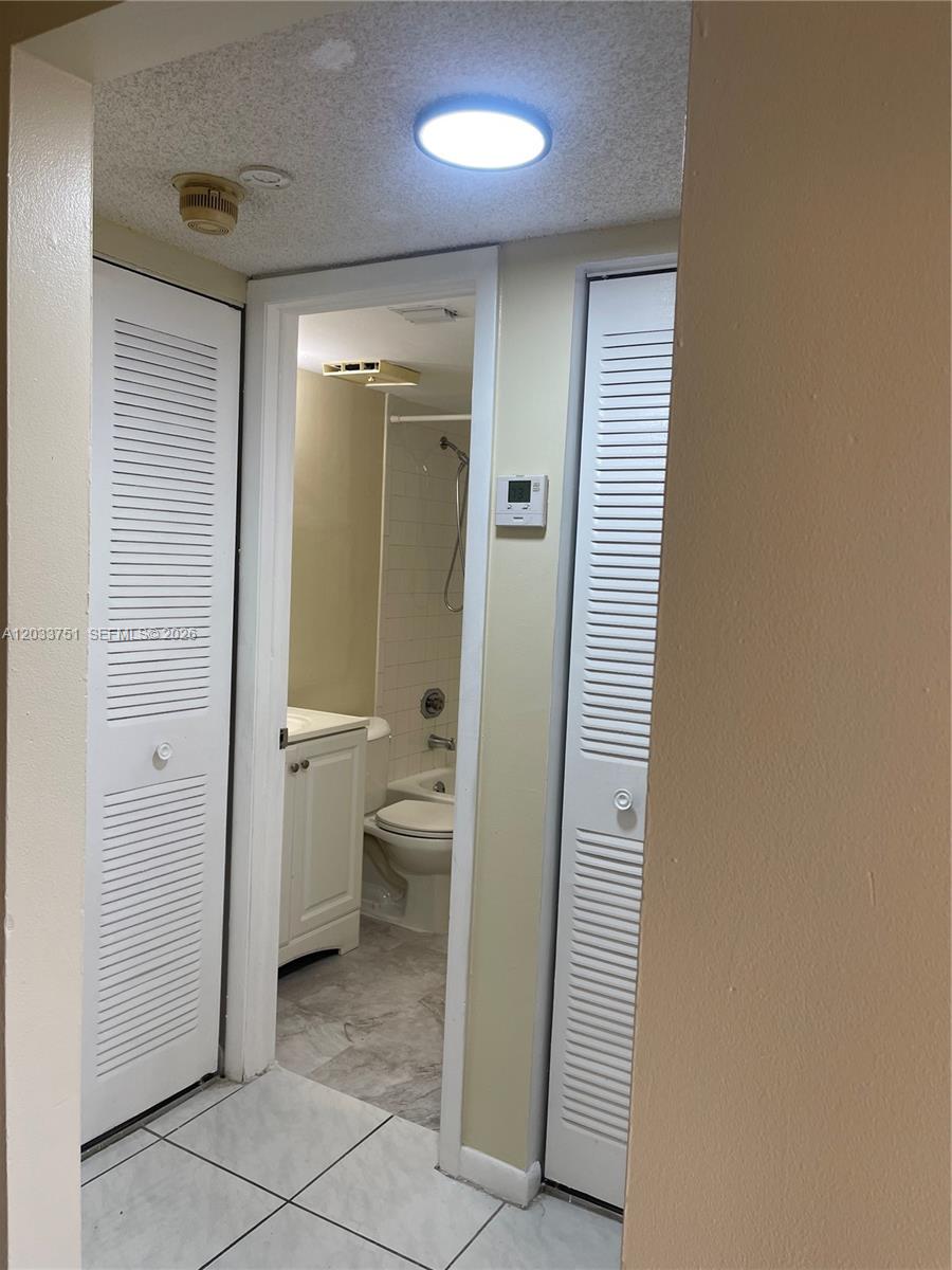 3252 Foxcroft Road, Unit 307 Miramar, FL 33025 - Photo 30 of 41 hallway between second bedroom and bathroom