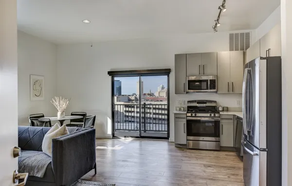 a kitchen with stainless steel appliances a stove and a refrigerator