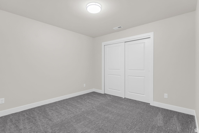 576 7th Avenue Midvale, UT 84047 - Photo 16 of 32 Unfurnished bedroom with dark carpet and a closet