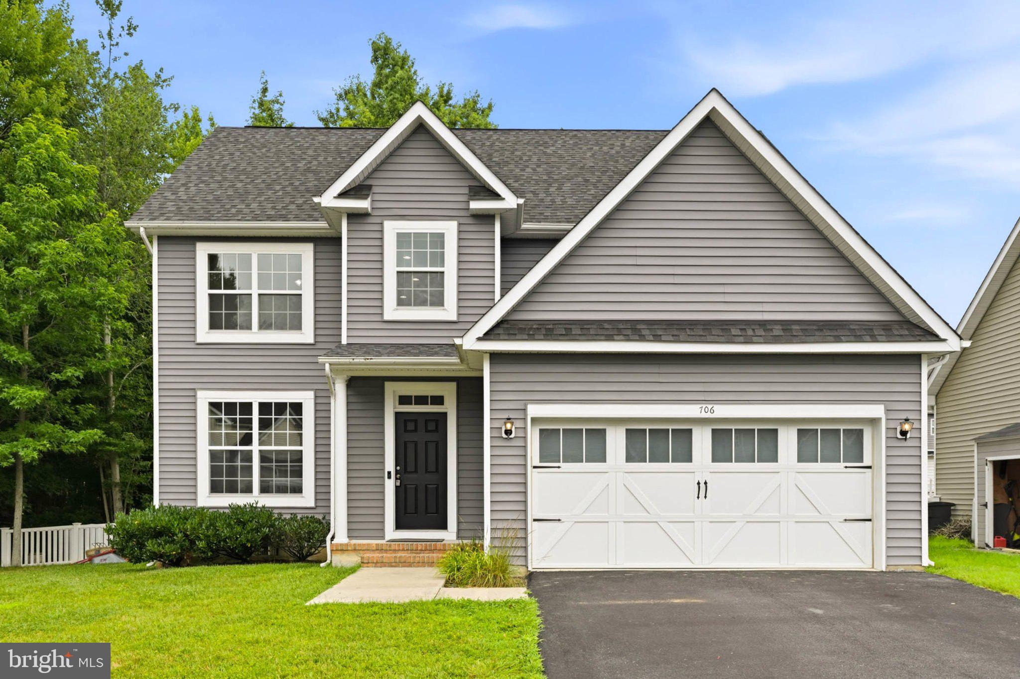 706 Trapper Way Deale, MD 20751 - Photo 57 of 61 Charming gray home with lush greenery.
