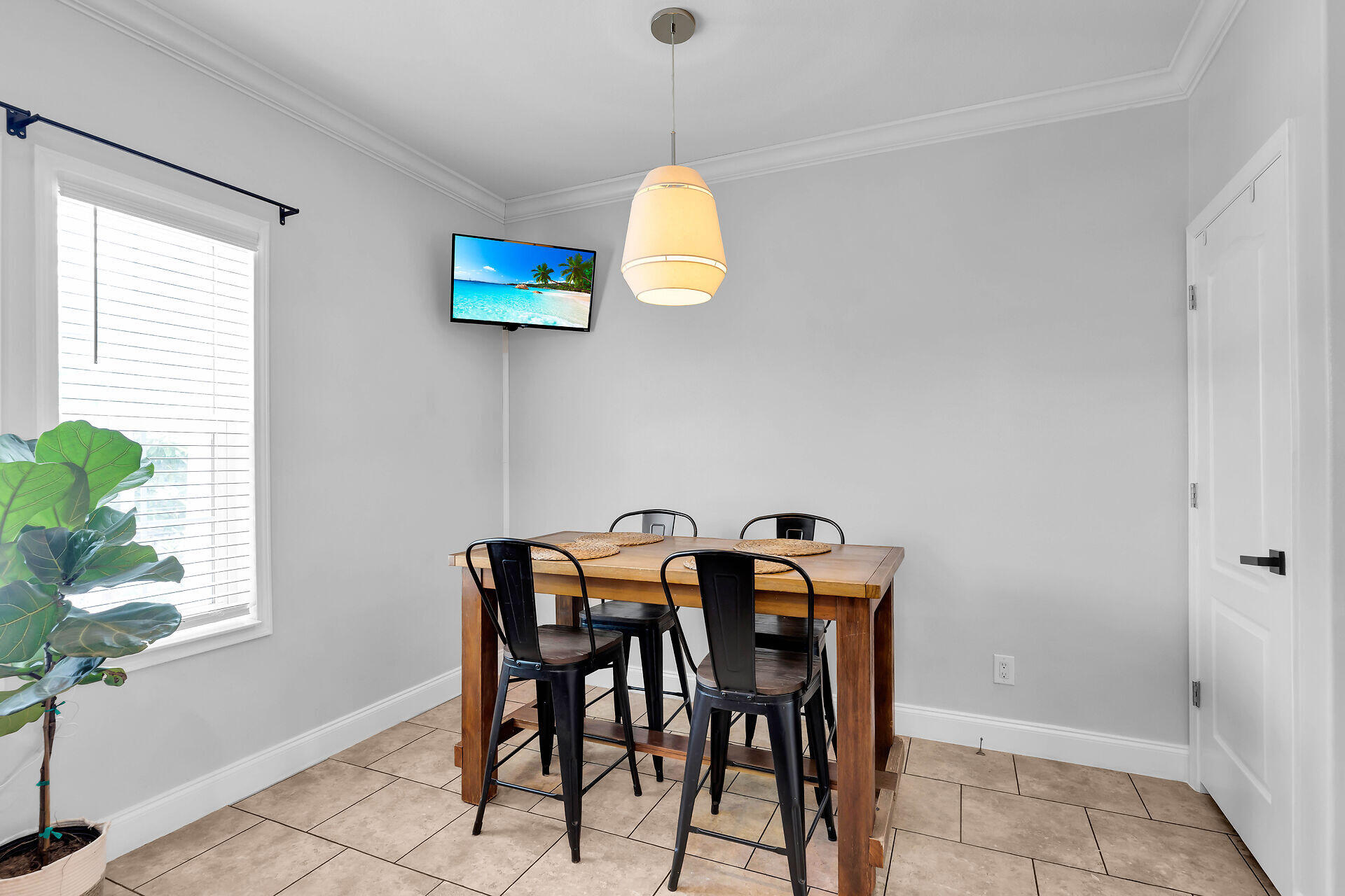 59 Ed Swift Road Key West, FL 33040 - Photo 9 of 35 a view of a dining room with furniture and wooden floor