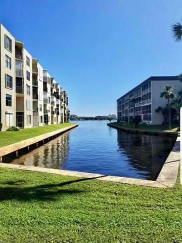 a view of swimming pool with outdoor seating