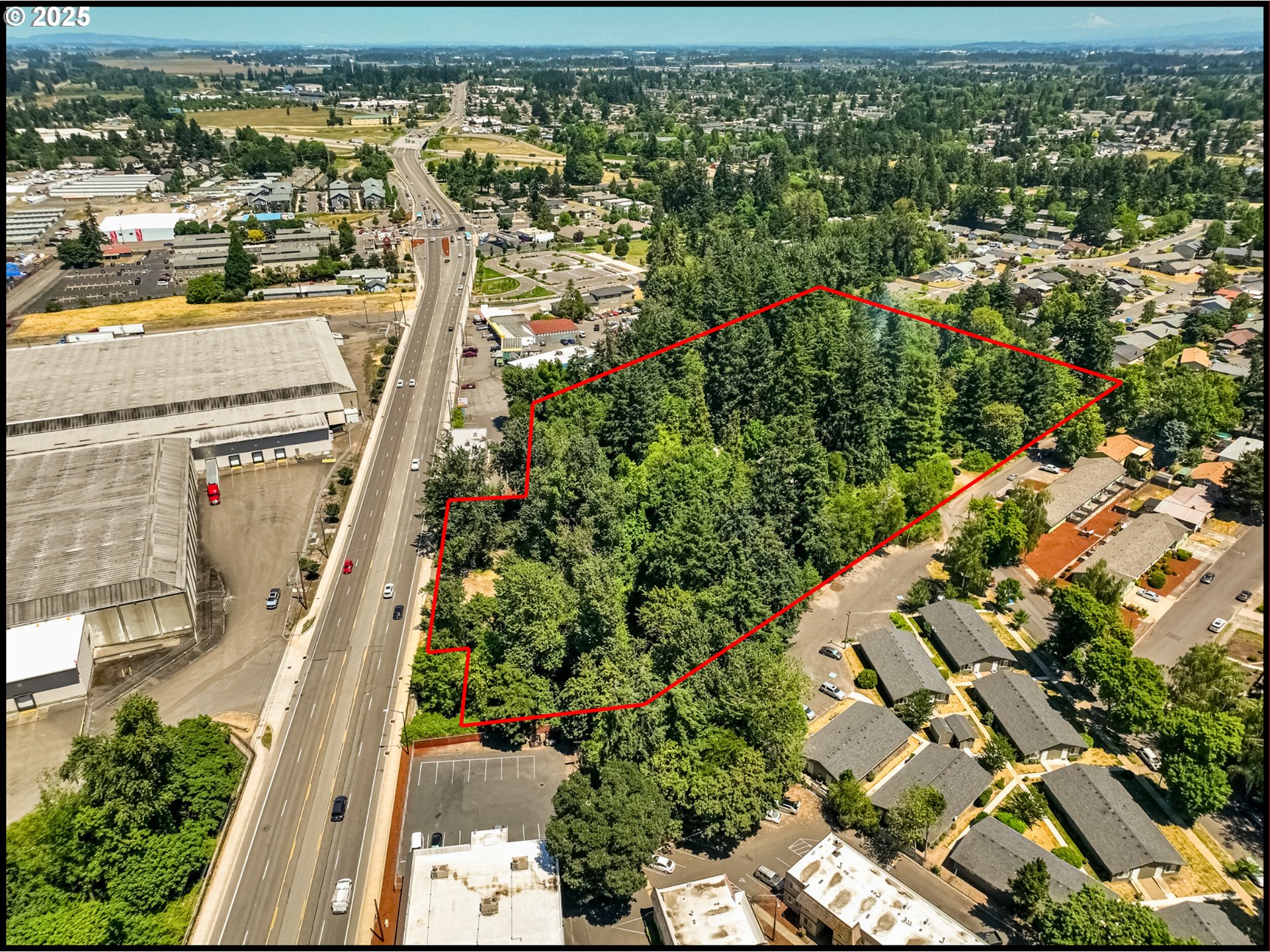 2557 Hummingbird Lane Northeast Salem, OR 97301 - Photo 1 of 7 an aerial view of residential houses with outdoor space
