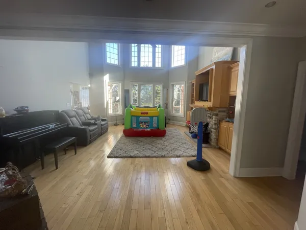a view of kitchen with furniture and a refrigerator