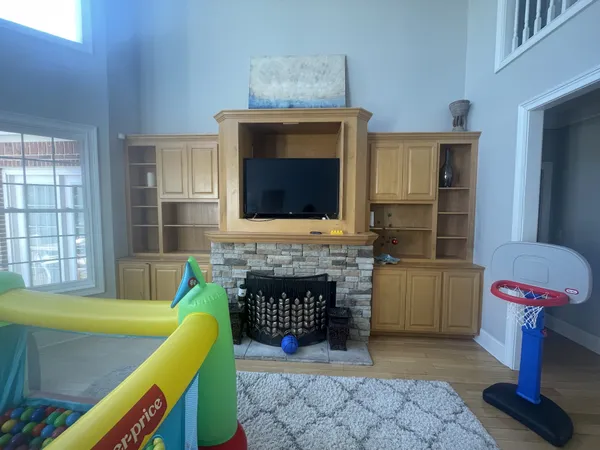 a kitchen with a sink appliances and cabinets