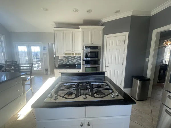 a bathroom with a double vanity sink and mirror