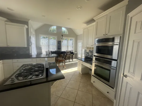 a bedroom with a bed and a chair