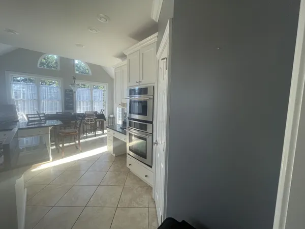 a room with gym equipment and a window