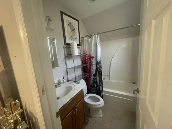 a spacious bathroom with a double vanity sink and a mirror