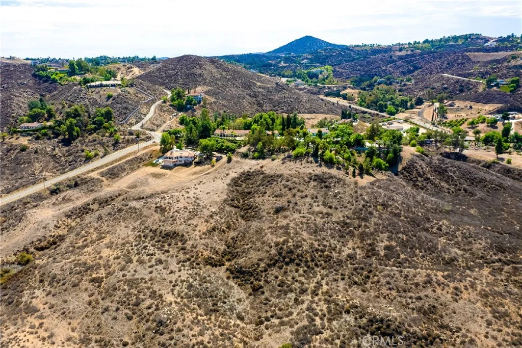 1 Heizer Drive Perris, CA 92570 - Photo 4 of 19 a view of a dry field with mountains in the background