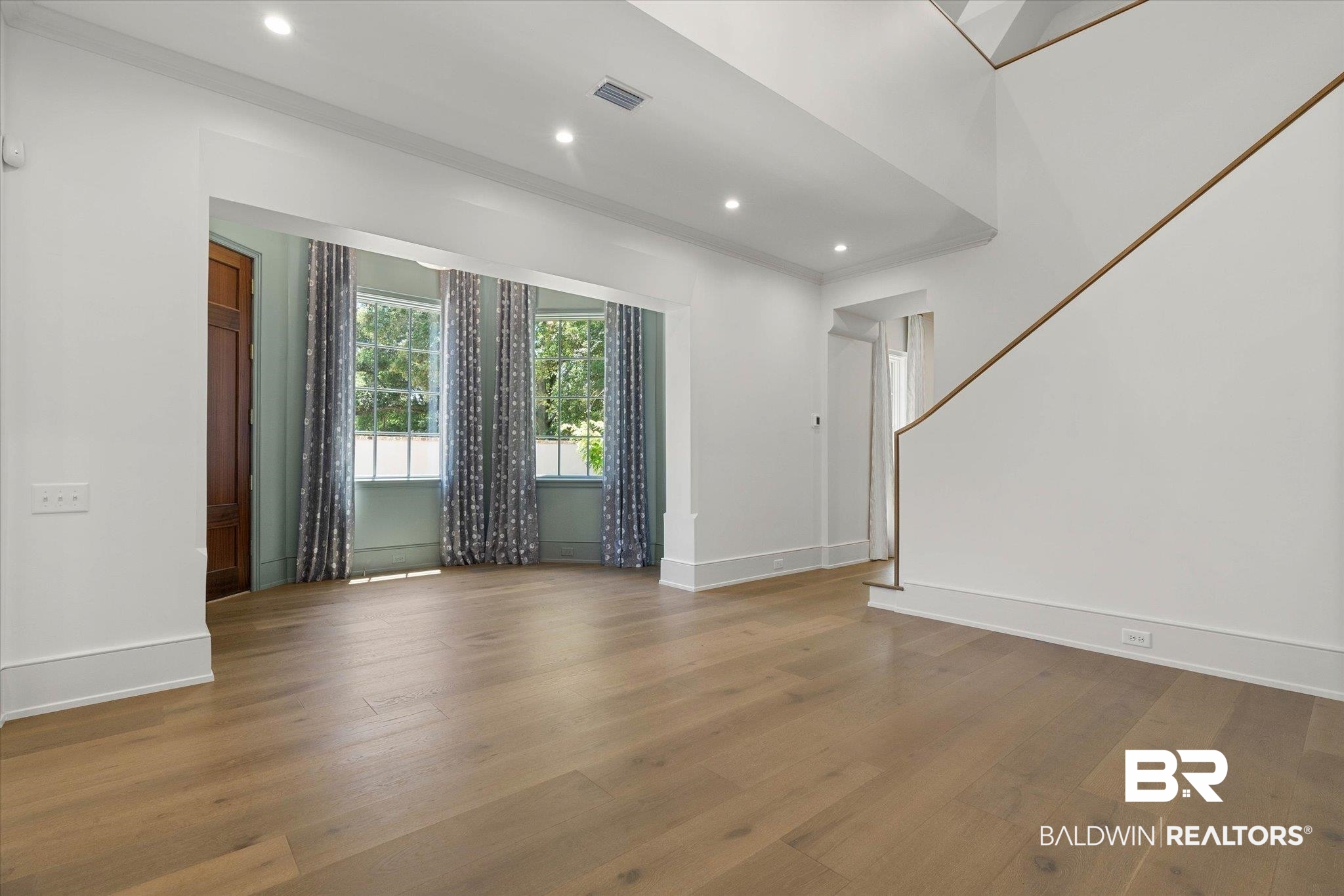 3 Canterbury Park Mobile, AL 36608 - Photo 5 of 43 Spare room with wood finished floors, baseboards, recessed lighting, and ornamental molding