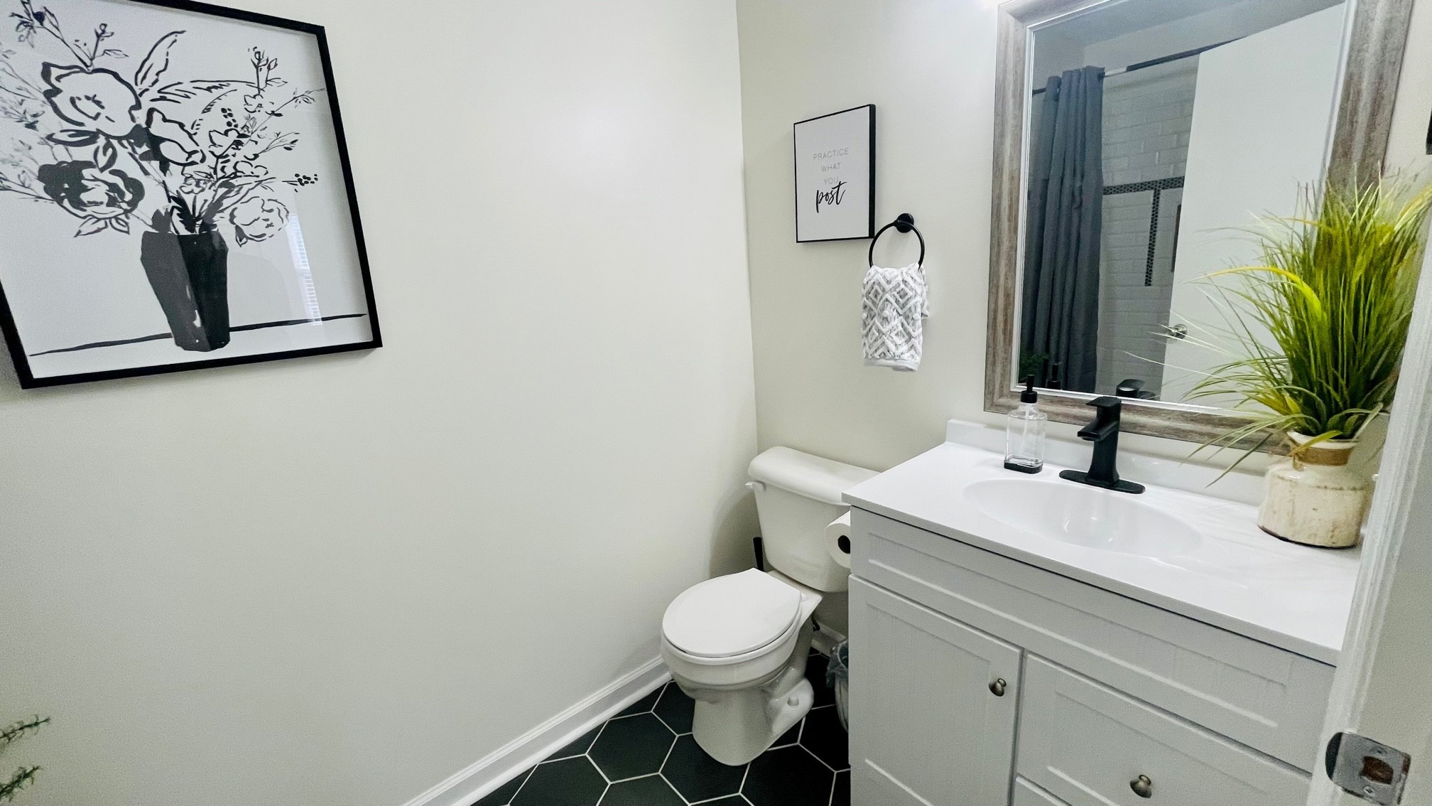 7526 Roundtree Avenue Murfreesboro, TN 37129 - Photo 12 of 67 a bathroom with a toilet sink and mirror