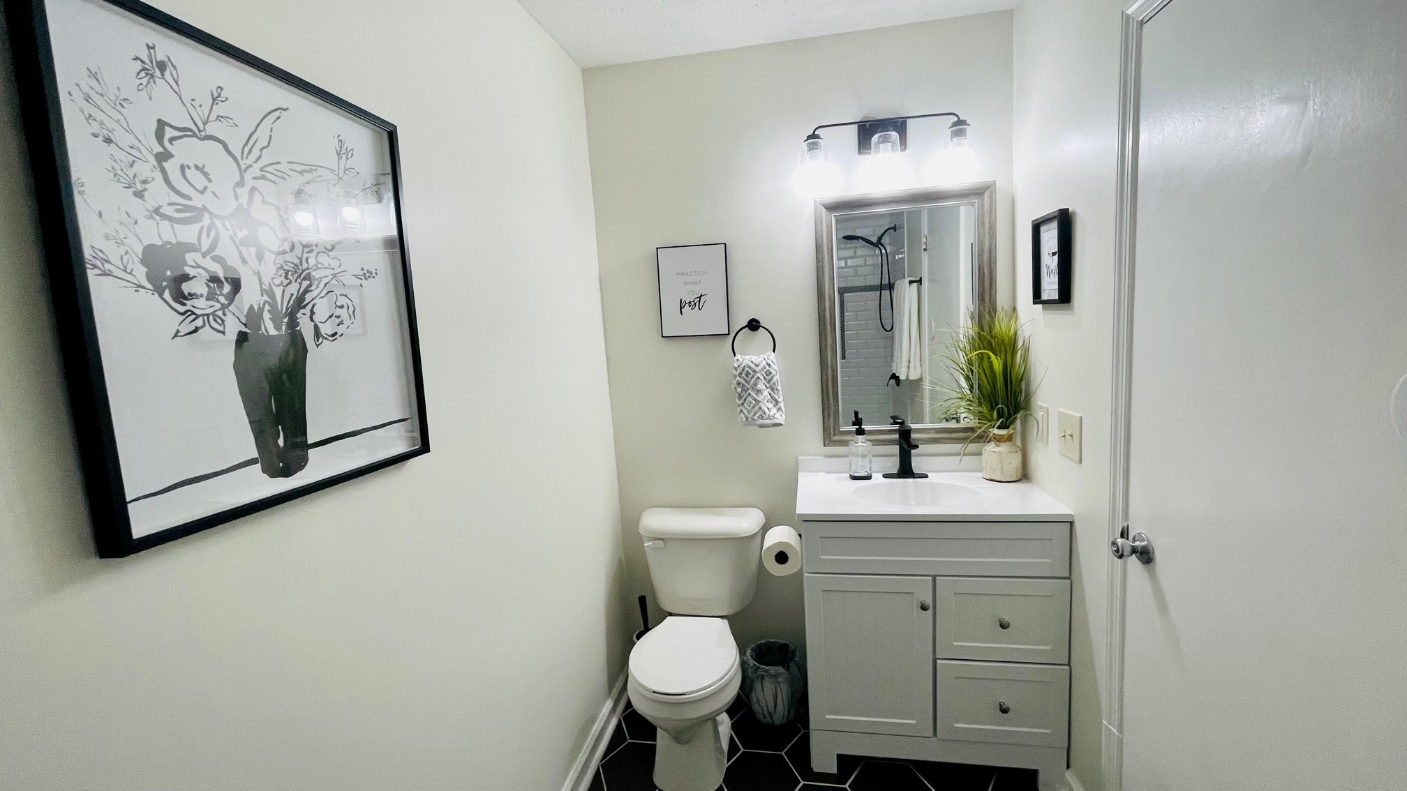 7526 Roundtree Avenue Murfreesboro, TN 37129 - Photo 16 of 67 a bathroom with a toilet sink and mirror
