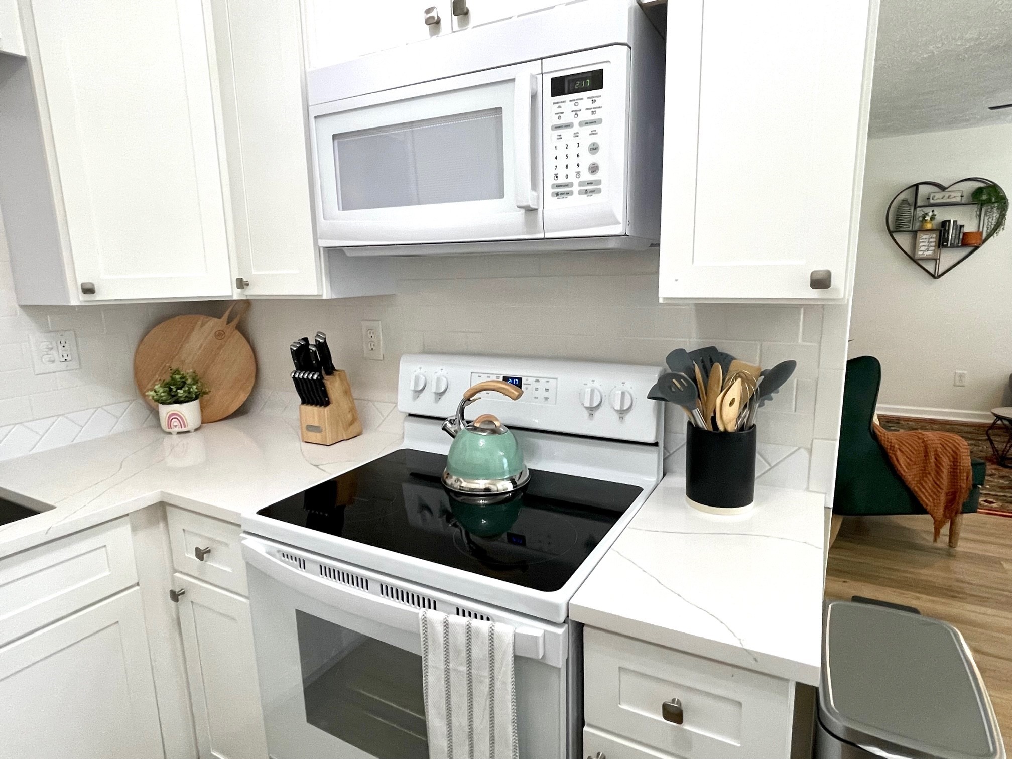 7526 Roundtree Avenue Murfreesboro, TN 37129 - Photo 40 of 67 a kitchen with a microwave a stove and cabinets