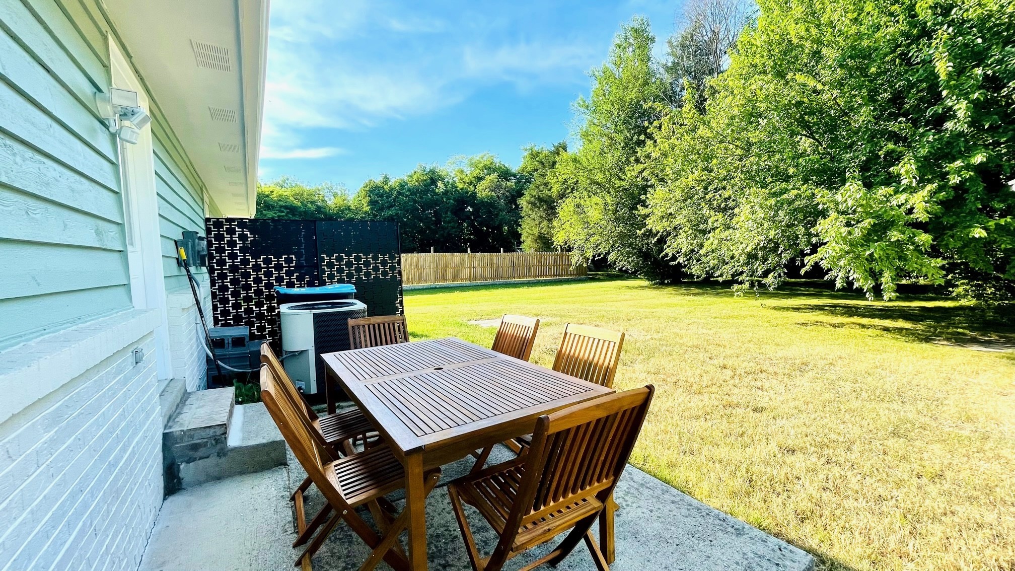 7526 Roundtree Avenue Murfreesboro, TN 37129 - Photo 55 of 67 a view of a patio with table and chairs with wooden floor and fence