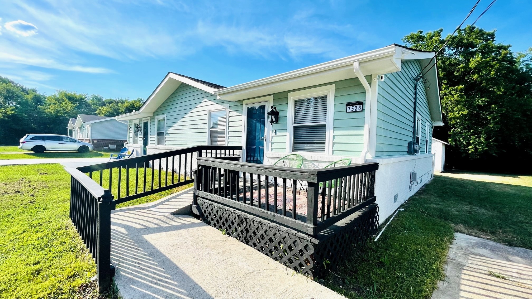 7526 Roundtree Avenue Murfreesboro, TN 37129 - Photo 57 of 67 a view of a deck with two chairs and a table