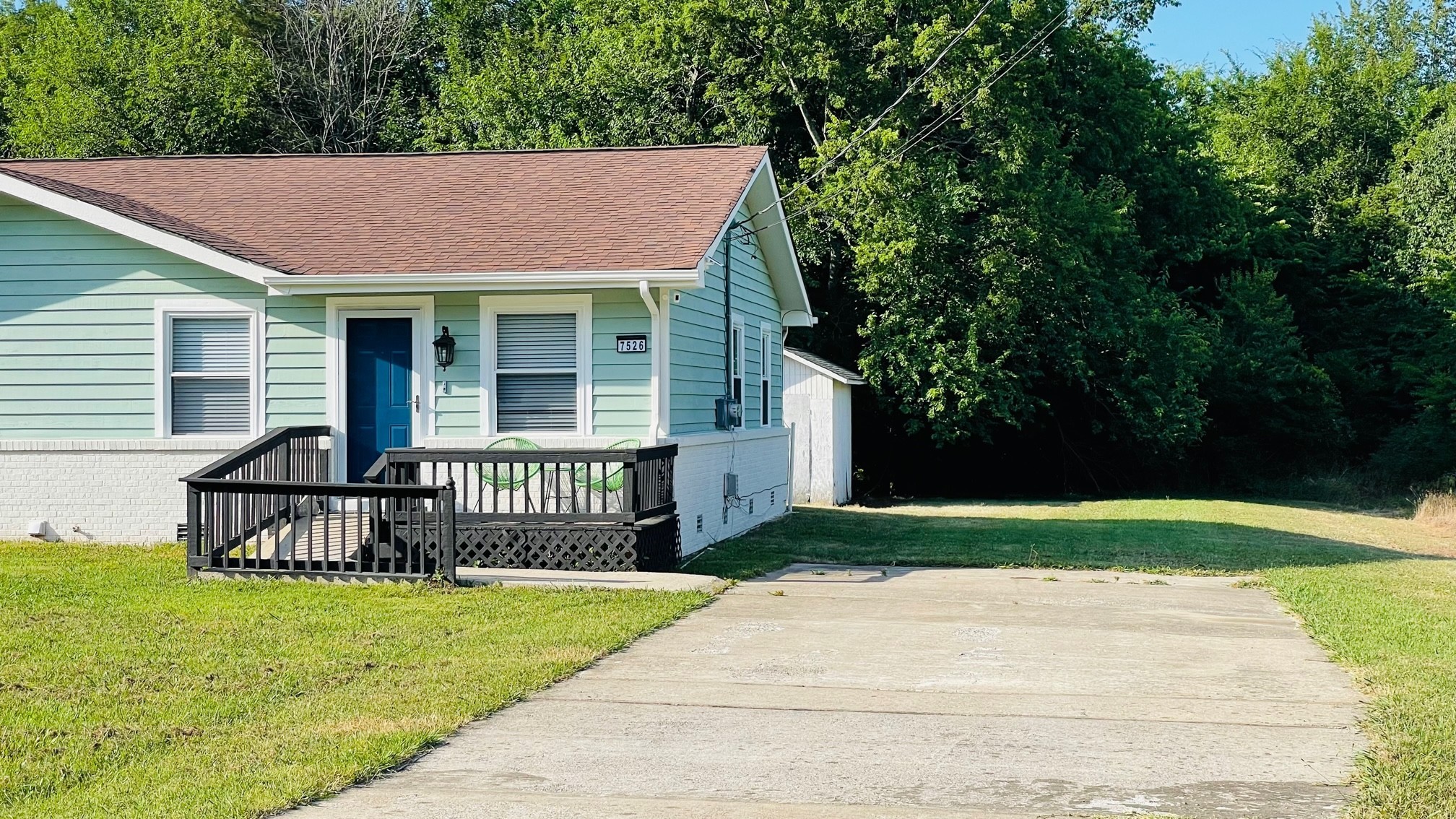 7526 Roundtree Avenue Murfreesboro, TN 37129 - Photo 59 of 67 a front view of a house with garden