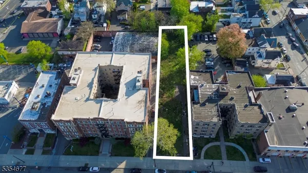 an aerial view of houses with outdoor space