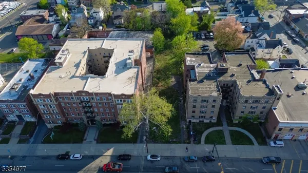 an aerial view of multiple houses with outdoor space
