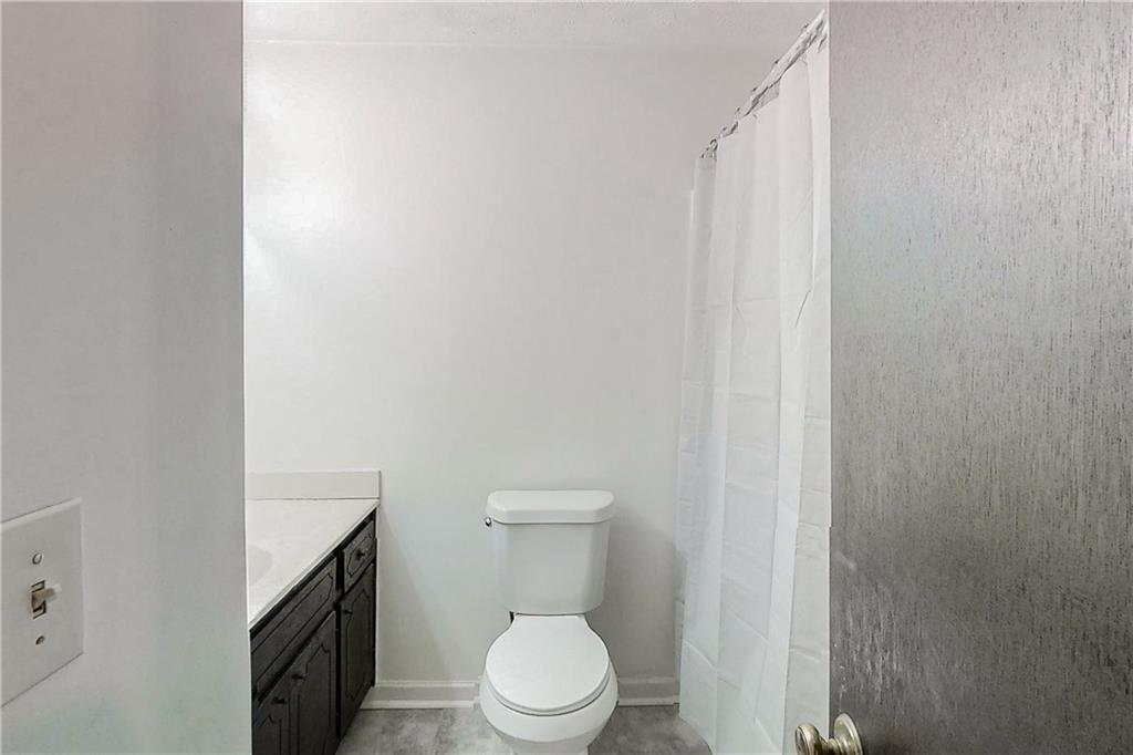 2284 Emerald Springs Drive Decatur, GA 30035 - Photo 6 of 30 a white toilet sitting next to a small bathroom